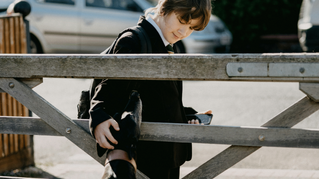 dog loving teen patting a dog