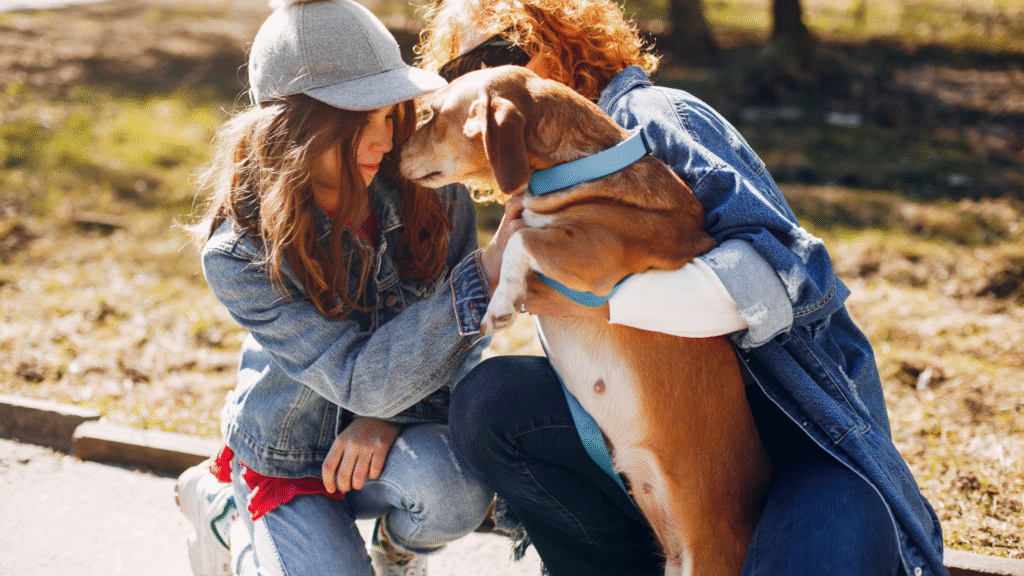 dog loving teen hugging a dog